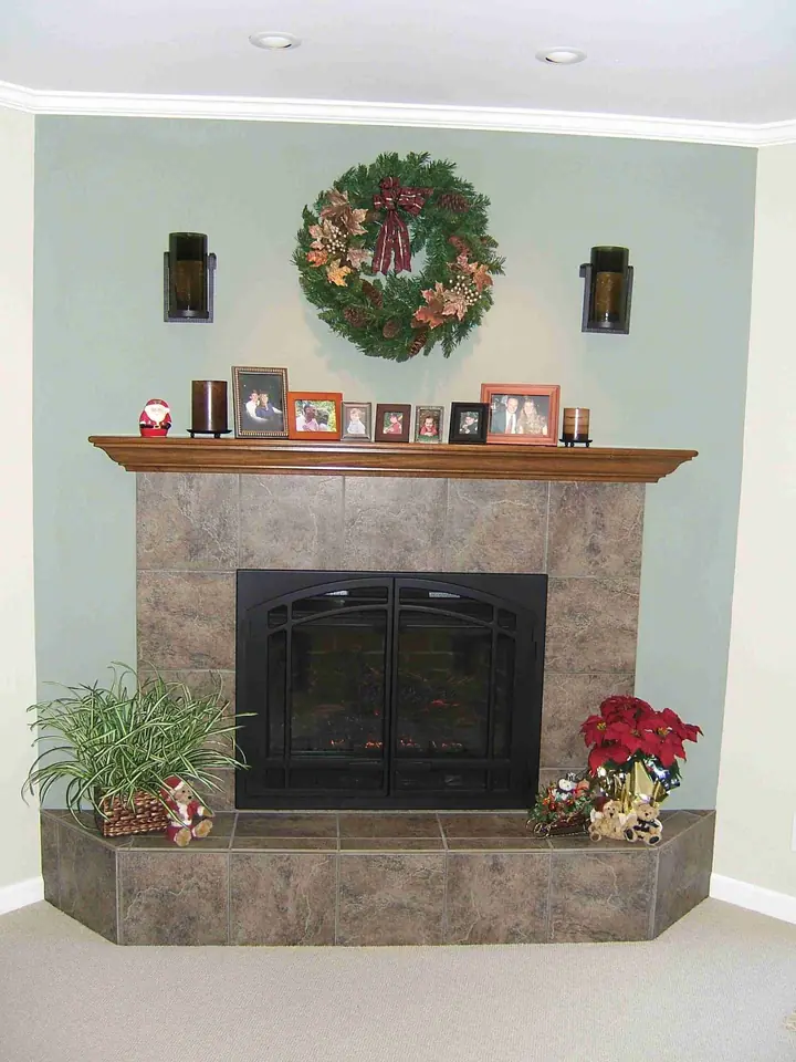 Finished fireplace remodel in Fairfax with a new mantel and tile surround