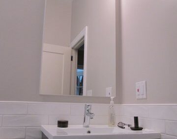 A simple, elegant bathroom featuring a floating vanity in Noe Valley, San Francisco
