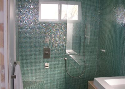 Penthouse master bath re-orientation remodel with glass tile. Oakland, Ca
